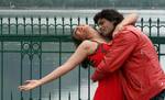 Indian Actors Preeti Jhangiani(L) and Mukesh Barti (R) perform during the shooting of a sequence for their upcoming movie 'Kash Tim Hamara Hota'Banks of world Famous Dal Lake in Srinagar, the summer capital of Indian Kashmir, 29 April 2012.