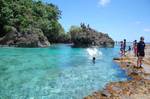 A crystal clear paradise-like lagoon is formed by a receded sea shore - siargao - philippines