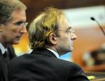 Christian Karl Gerhartsreiter, who calls himself Clark Rockefeller, appears at Suffolk Superior Court Monday, Dec. 1, 2008. Sitting next to him is defense attorney Jeffrey Denner, left. Rockefeller will get back about half of the gold coins and cash seized by federal authorities after he was arrested for allegedly kidnapping his 7-year-old daughter, Reigh Boss, during a supervised visit in Boston in July. Prosecutors agreed to turn over 160 gold coins _ worth about $140,000 _ and $6,480 in cash