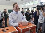 National Party leader John Key votes in the New Zealand general election at Parnell School, Auckland, New Zealand, Saturday, Nov. 8, 2008. The two major parties _ Prime Minister Helen Clark's Labour and conservative John Key's Nationals _ are almost certain not to gain a majority in the 123-seat Parliament in their own right. A complex proportional voting system ensures significant numbers of seats will go to a handful of small parties.