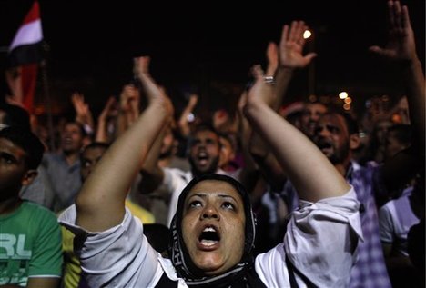 A female Egyptian Muslim Brotherhood supporter chants slogans during an anti-ruling military council demonstration in Tahrir Square, Cairo, Egypt Wednesday, June 20, 2012.