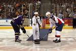 Serviceman 1st Class Cedric Avant, Sailor of the Quarter aboard the guided-missile destroyer USS Nitze (DDG 94), drops the first puck at a Norfolk Admirals hockey game.