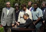 President Barack Obama signs a Presidential Memorandum outlining the next steps for cleaner and more efficient vehicles, Friday, May 21, 2010, in the Rose Garden of the White House in Washington. From left are, Transportation Secretary Ray LaHood, White House energy czar Carol Browner, EPA Administrator Lisa Jackson, Navistar Chief Executive Officer Daniel Ustian, Waste Management driver Anthony Dunkley and Daimler Trucks North America Chief Executive Officer Martin Daum.