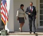 President Barack Obama, followed by EPA Administrator Lisa Jackson, walks from the Oval Office to the Rose Garden of the White House in Washington, Friday, May 21, 2010, to sign a Presidential Memorandum outlining the next steps for cleaner and more efficient vehicles.