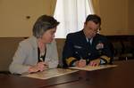 WASHINGTON - Rear Adm. Kevin Cook, Coast Guard Director of Prevention Policy, and Cynthia Giles, Environmental Protection Agency Assistant Administrator, Enforcement and Compliance Assurance, sign a Coast Guard and EPA Vessel General Permit Memorandum of Understanding at EPA Headquarters, Feb. 11, 2011. The Vessel General Permit MOU outlines the cooperative efforts that the Coast Guard and the EPA will undertake to ensure that vessels comply with Vessel General Permit requirements. U.S. Coast Gu