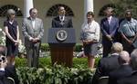 President Barack Obama speaks in the Rose Garden of the White House in Washington, Friday, May 21, 2010, before he sign a presidential memorandum outlining the next steps of cleaner and more efficient vehicles. From left are, White House energy czar Carol Browner, Transportation Secretary Ray LaHood, the president, EPA Administrator Lisa Jackson, Navistar Chief Executive Officer Daniel Ustian and Waste Management driver Anthony Dunkley.