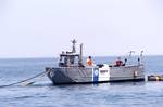 Sailors attached to the Navy Support Salvage (NAVSALV) unit work with Environmental Protection Agency (EPA) on simulated oil spill disaster on Lake Michigan.