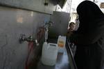 Palestinian students drink water from a public tap in the United Nations Relief and Works Agency (UNRWA) headquarters in Rafah refugee camp in the southern of Gaza Strip on November 02, 2011. The United States cut its funding to the UN's cultural arm after a majority of member states defied American and Israeli warnings and voted to allow jubilant Palestinians full membership in the organisation. PHOTO BY AHMED DEEB/WN