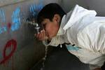 Palestinian students drink water from a public tap in the United Nations Relief and Works Agency (UNRWA) headquarters in Rafah refugee camp in the southern of Gaza Strip on November 02, 2011. The United States cut its funding to the UN's cultural arm after a majority of member states defied American and Israeli warnings and voted to allow jubilant Palestinians full membership in the organisation. PHOTO BY AHMED DEEB/WN