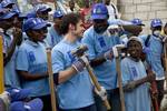 Kris Allen, last year American Idol winner, with a crew of Haitians working for the 'Work for Cash' UNDP program in Carrefour, Port au Prince. The UN foundation negotiated with American Idol to do an