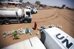 25 July 2011. Kodiel: Distribution of 40,000 liters of water among the local community in El Srief (North Darfur), that includes Shiero, Metwier, Eata Ibrahim, Ahmed, Ali and Kodiel villages. The nearest water point is 15 kilometers away and the women have to spend 6 hours a day to collect the water for their families. Due to the drought, the community leaders report that the lack of water is severe in the area and it specially affects children and sick people. This water distribution was part o