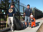 Engineman 2nd Class George Vidal and his family pick up trash outside 32nd Street Naval Station during the 11th annual Main Street Clean Up.