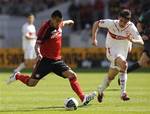 Stuttgart's Christian Traesch, right, and Leverkusen's Arturo Vidal challenge for the ball during the German first division Bundesliga soccer match between VfB Stuttgart and Bayer Leverkusen in Stuttgart, Germany, on Saturday April. 17, 2010.