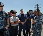 Hospital Corpsman 1st Class Marc Vidale briefs visitors about the littoral combat ship USS Freedom (LCS 1).