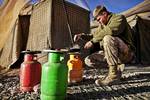 U.S. Marine Lance Cpl. Tom Morton, a 23-year-old team leader with 3rd Platoon, Kilo Company, 3rd Battalion, 3rd Marine Regiment, and native of Nashville, Tenn., cooks eggs for breakfast before beginning his duties here, Feb. 25. Patrol Base Bury, a tiny base contained by concertina wire and giant Hesco barriers, is the humble home of the 3rd Platoon Marines during their seven-month deployment to Helmand provinceâ€™s Garmsir district. When they finish long days of patrolling and standing post, th