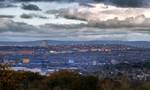 Ashton-under-Lyne and neighboring Oldham viewed from Werneth Low. Generally the bedrock of the west of the town consists of coal measures, which were exploited by the coal mining industry, while the east is mainly millstone grit.