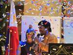 Confetti rain on Filipino boxer and Congressman Manny Pacquiao during a news conference upon arrival in Manila, Philippines, early Saturday, June 16, 2012 from Los Angeles.