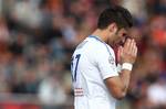 Montpellier's French forward Olivier Giroud reacts during his French League One soccer match, Sunday, April 15, 2012 in Lorient, western France. Lorient won 2-1. Giroud's 20th league goal of the season failed to save leader Montpellier as it slipped to a 2-1 defeat at struggling Lorient on Sunday, opening the door for Paris Saint-Germain in the closely-contested French title race.