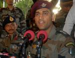 Mahendra Singh Dhoni, Indian cricket team captain and honourary Lieutenant Colonel in the Indian Territorial Army, looks on during a press conference at the Army headquarters in Baramulla, north of Srinagar, on June 3,2012. The cricket boards of India and Pakistan are the ones to decide on the timing and venue for any bilateral cricketing engagements between the two countries, Dhoni said. Dhoni visited the frontier district of Baramulla along the Line of Control in and interacted with soldiers a