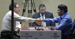 World Chess champion Viswanathan Anand from India, right, shakes hand with Boris Gelfand of Israel after defeating him at the FIDE World Chess Championship tie break match at Moscow's Tretyakovsky State Gallery, Russia, Wednesday, May 30, 2012.