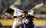 South Korean Jeonbuk Hyundai Motors FC´s Choi Jin-cheul, top, and Auckland City FC´s Keryn Jordan battle for the ball during their fifth place match of their FIFA Club World Cup soccer in Tokyo Friday, Dec 15, 2006. Jeonbuk FC won the match,