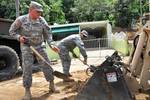 U.S. Soldiers with the 130th Engineer Battalion and Alpha Company, 296 Infantry, 2-65th Infantry Battalion help with recovery efforts after days of rain caused mudslides in Utuado, Puerto Rico, March 31, 2012. (U.S. Army photo by Pfc. Eliezer Melendez/Released)