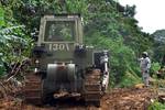 U.S. Soldiers with the 130th Engineer Battalion and Alpha Company, 296 Infantry, 2-65th Infantry Battalion help with recovery efforts after days of rain caused mudslides in Utuado, Puerto Rico, April 1, 2012. (U.S. Army photo by Pfc. Eliezer Melendez/Released)