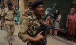 Indian paramilitary troops keep vigil After in Srinagar on June 15,2012. Suspected Muslim rebels gunned down Ganaie in the latest string of alleged political killings in Kashmir. Ganaie was shot at close range by suspected rebels as he was leaving his home to offer Friday prayers at a local mosque,police said.