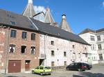 A malt house (1880) in Lessines, Belgium. A malt house, or maltings, is a building where cereal grain is converted into malt by soaking it in water, allowing it to sprout and then drying it to stop further growth