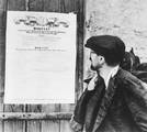 A communist propaganda photo of a citizen reading the PKWN Manifesto, issued on July 22, 1944