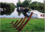 Rockland staithe with remnants of a Norfolk wherry in foreground. In medieval times Norwich was noted for its black-glazed roofing tiles[2] which were made in Rockland and transported by river from the staithe.