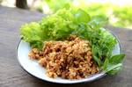 Naem khluk or yam naem khao thot, a Thai salad made with deep-fried glutinous rice and fermented pork skin