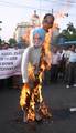 All India Anti Imperialist Forum activists prepare to burn a combined effigy representing Indian Prime Minister Manmohan Singh and US President Barack Obama during a protest rally in Kolkata on June 11, 2012. The demonstrators protested against the presence of the US naval fleet in the Indian Ocean and demanded the immediate withdrawal of the force