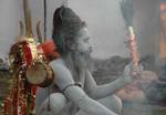 A old Indian Sadhu - Hindu holy man - blesses a pilgrim at a temporary camp in Kolkata, 08 January 2008. Thousands of Hindu pilgrims have started to converge for the Gangasagar Mela which will culminate on 14 January, on the occasion of Makar Sankranti, a holy day of the Hindu calendar, during which a dip in the ocean at the confluence of the River Ganges and the Bay of Bengal, some 150 kms south of Kolkata, is considered to be of great religious significance in Eastern India