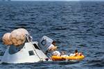 The prime crew of the first manned Apollo mission (Spacecraft 101/Saturn 205) participates in water egress training in the Gulf of Mexico. Left to right, are astronauts Walter M. Schirra Jr. (stepping into life raft), Donn F. Eisele, and Walter Cunningham.