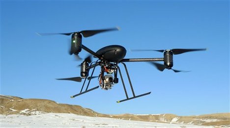 File - In this Jan. 8, 2009, photo provided by the Mesa County Sheriff's Department, a small Draganflyer X6 drone is photographed during a test flight in Mesa County, Colo., with a Forward Looking Infared payload.