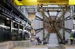 The last element, weighing 100 tonnes, of the ATLAS (A Toroidal LHC ApparatuS) experiment is lowered into the cave at the European Organization for Nuclear Research CERN (Centre Europeen de Recherche Nucleaire) in Meyrin, near Geneva, Switzerland, Feb. 29, 2008. ATLAS is part of five experiments which, from mid 2008 on, will study what happens when beams of particles collide in the 27 km (16.8 miles) long underground ring LHC (Large Hadron Collider). ATLAS is one of the largest collaborative eff