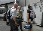 Dan Rather, CBS Anchorman and his news crew return to the USS Abraham Lincoln (CVN 72) after touring the island of Sumatra, Indonesia.