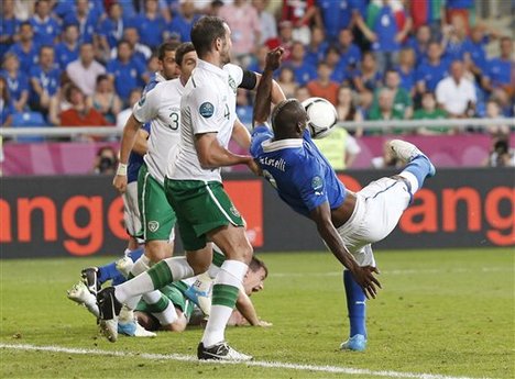 Italy's Mario Balotelli scores his side's second goal during the Euro 2012 soccer championship Group C match between Italy and the Republic of Ireland in Poznan, Poland, Monday, June 18, 2012.