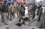 Indian policemen inspect the spot in Srinagar, the summer capital of Indian Kashmir, 20, April, 2012.