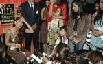 Bollywood actress Kareena Kapoor, left, talks with reporters after winning her best female performance award in the film 