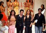 Indian designer Manish Malhotra, extreme right, with Bollywood actors Kareena Kapoor, second right, Shahid Kapoor, third left, and Urmila Matgonkar, in the designer's clothes, during the Wills India Fashion Week in New Delhi, India, Sunday, Sept. 3, 2006.