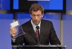 Actor Hugh Laurie accepts the award for individual achievement in drama for his work on ´ House´ at the 22nd Annual Television Critics Association Awards held Sunday, July 23, 2006 in Pasadena, Calif. (AP Photo/Phil McCarten) nf2