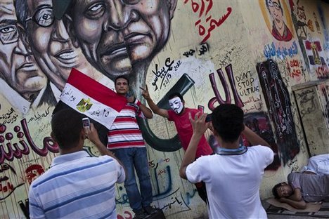 Egyptians celebrate the victory of Mohammed Morsi, in the presidential elections in Tahrir Square, Cairo, Egypt, Monday, June 25, 2012.