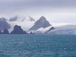 Fort Point and St. Kiprian Peak, Greenwich Island from Bransfield Strait. Greenwich Island (variant historical names Sartorius Island, Berezina Island) is an island 15 miles (24 km) long and from 0.5 to 6 mi (0.80 to 9.7 km) (average 3.25 mi/5.23 km) wide, lying between Robert Island and Livingston Island in the South Shetland Islands.