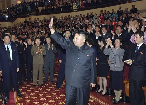 In this Tuesday, May 1, 2012 photo released by the Korean Central News Agency and distributed by the Korea News Service Wednesday, May 2, 2012, North Korea's leader Kim Jong Un waves during his visit to the People's Theatre in Pyongyang, North Korea, for a concert given by the Unhasu Orchestra to mark May Day.