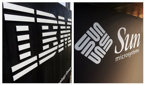 In this combo made from file photos, the IBM logo is seen in front of the company's manufacturing plant in Essex Junction, Vt., left, and the Sun Microsystems logo is seen at the company's offices in Menlo Park, Calif