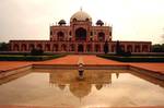 Front view with reflections, central water channel in the 'Chahr Bagh' Garden. At present, threats to this monument arise from a potential terrorist attack or from vandalism as well as the regular mushrooming of illegal constructions and plastic waste thrown within the prohibited area around Humayun's Tomb.