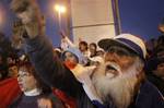 A supporter of Paraguay's President Fernando Lugo shouts outside Congress where the Senate is holding Lugo's impeachment trial in Asuncion, Paraguay, Friday, June 22, 2012.