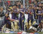 Kolkata Knight Riders batsman Gautam Gambhir (C) walks back after losing his wicket as his teammates applaud his innings of 93 runs during the IPL Twenty20 cricket match between Kolkata Knight Riders and Royal Challengers Bangalore at The Eden Gardens in Kolkata on April 28, 2012.